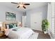 Comfortable bedroom with ceiling fan, ensuite bathroom and large closet with white doors at 809 Covelo Ln., Myrtle Beach, SC 29579