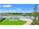 Waterfront community featuring a lakeside pergola, beach, picnic tables, and scenic water views at 809 Covelo Ln., Myrtle Beach, SC 29579