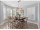 Bright dining room with shuttered windows and designer light fixture at 809 Covelo Ln., Myrtle Beach, SC 29579