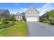 Charming home featuring a well-maintained lawn, a two-car garage, and a welcoming entrance at 809 Covelo Ln., Myrtle Beach, SC 29579