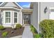 Inviting front entrance with a welcoming door and beautifully landscaped flower beds at 809 Covelo Ln., Myrtle Beach, SC 29579