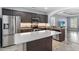 Modern kitchen features an island, stainless appliances, and granite countertops at 809 Covelo Ln., Myrtle Beach, SC 29579