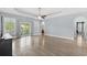 Bright living room with tray ceiling, ceiling fan, and access to a patio at 809 Covelo Ln., Myrtle Beach, SC 29579