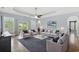 Bright living room featuring a tray ceiling, and patio access at 809 Covelo Ln., Myrtle Beach, SC 29579