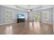 Spacious living room with tray ceiling, ceiling fan, and patio access at 809 Covelo Ln., Myrtle Beach, SC 29579