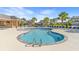 Community pool with lounge chairs, poolside furniture and palm trees at 809 Covelo Ln., Myrtle Beach, SC 29579