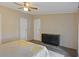 Cozy bedroom with black dresser and doors, a ceiling fan and a neutral color scheme at 8404 Bloomwood Dr., Myrtle Beach, SC 29588