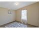 Cozy bedroom enhanced with a patterned rug and natural light from the window at 8404 Bloomwood Dr., Myrtle Beach, SC 29588