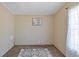 Bright bedroom featuring neutral walls, patterned rug, and natural light at 8404 Bloomwood Dr., Myrtle Beach, SC 29588