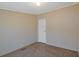 Neutral bedroom featuring plush carpet, ample lighting and access to the en-suite bathroom at 8404 Bloomwood Dr., Myrtle Beach, SC 29588