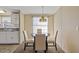 Cozy dining area with a round table, chairs, and view into kitchen space at 8404 Bloomwood Dr., Myrtle Beach, SC 29588