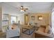 Open-concept living room and dining area with modern furnishings and natural light at 8404 Bloomwood Dr., Myrtle Beach, SC 29588