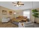 Comfortable living room featuring a leather sofa, neutral armchairs, and a rustic wood coffee table at 8404 Bloomwood Dr., Myrtle Beach, SC 29588