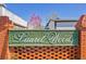 The Laurel Woods community sign is made of brick and the name is in green lettering at 8404 Bloomwood Dr., Myrtle Beach, SC 29588