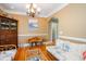 Cozy dining room with nice hardwood floors, natural lighting, and charming decor at 9 Gasparilla Circle, Murrells Inlet, SC 29576