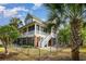 Spacious two-story home with double porches, well-maintained yard, and mature trees at 9 Gasparilla Circle, Murrells Inlet, SC 29576