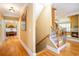 Hallway view of hardwood floors, staircase, and view to living room and main bedroom at 9 Gasparilla Circle, Murrells Inlet, SC 29576