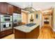 Gourmet kitchen with stainless steel appliances, center island, and custom cabinetry at 9 Gasparilla Circle, Murrells Inlet, SC 29576