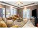 Comfortable living room with a large TV, and access to an outdoor balcony at 9 Gasparilla Circle, Murrells Inlet, SC 29576