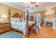 This grand main bedroom offers a seating area, fireplace, hardwood floors, and backyard access at 9 Gasparilla Circle, Murrells Inlet, SC 29576