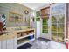 Poolside kitchen featuring wooden cabinets, sink, refrigerator, and view to backyard at 9 Gasparilla Circle, Murrells Inlet, SC 29576