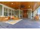 Inviting covered porch with comfortable seating, rocking chairs, and a warm, welcoming ambiance at 9 Gasparilla Circle, Murrells Inlet, SC 29576