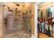 Walk-in shower features tile walls and floor, built-in niches, and dual shower heads at 9 Gasparilla Circle, Murrells Inlet, SC 29576