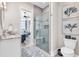 Modern bathroom featuring a glass-enclosed shower and a stylish vanity with stone countertops at 9407 Venezia Circle, Myrtle Beach, SC 29579