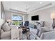 Comfortable living room with plush seating and a view of the outdoor landscape at 9407 Venezia Circle, Myrtle Beach, SC 29579