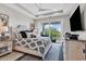 Bright main bedroom featuring a ceiling fan and a private balcony with scenic views at 9407 Venezia Circle, Myrtle Beach, SC 29579