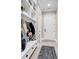Convenient mudroom with a built-in bench, storage shelves, and coat hooks at 9407 Venezia Circle, Myrtle Beach, SC 29579