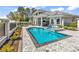 Luxury home boasts a stunning pool and spa with meticulously landscaped grounds for outdoor enjoyment at 9407 Venezia Circle, Myrtle Beach, SC 29579
