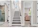 Modern staircase leading upstairs with a view of bathroom and bedroom for reference at 9407 Venezia Circle, Myrtle Beach, SC 29579
