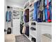 Well-organized walk-in closet with built-in shelving and hanging rods for clothes and accessories at 9407 Venezia Circle, Myrtle Beach, SC 29579