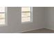Bright bedroom with two windows offering natural light and neutral walls and carpet at 978 Cherrystone Loop, Conway, SC 29526