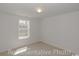 Bright, empty bedroom with a window, neutral carpet and walls at 978 Cherrystone Loop, Conway, SC 29526