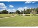 Scenic golf course view with pond and fountain on a sunny day with blue sky at 978 Cherrystone Loop, Conway, SC 29526