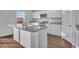Bright kitchen with granite countertops, stainless steel appliances, and a functional center island at 978 Cherrystone Loop, Conway, SC 29526