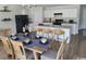Charming dining area with stylish decor and an island with barstools, adjacent to the kitchen at 985 Cherrystone Loop, Conway, SC 29526