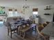 Open-concept dining area with a wooden table and seating, adjoining the living room at 985 Cherrystone Loop, Conway, SC 29526