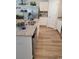 Well-equipped kitchen with granite countertops, a stainless steel refrigerator, and hardwood floors at 985 Cherrystone Loop, Conway, SC 29526