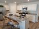 Modern kitchen with stainless steel appliances, granite countertops, and island seating at 985 Cherrystone Loop, Conway, SC 29526