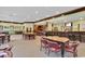Spacious restaurant area featuring a bar, tables, and chairs for community members to enjoy at 985 Cherrystone Loop, Conway, SC 29526