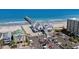 Beautiful aerial view of a pier and beachfront area featuring a restaurant and parking at 1016 Saluda River Rd., Myrtle Beach, SC 29588