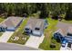 Aerial view of the houses, landscaping, and driveways of three beautiful homes in a wooded neighborhood at 1016 Saluda River Rd., Myrtle Beach, SC 29588