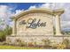 Beautiful stone entrance sign to The Lakes community, complete with manicured landscaping and a welcoming aesthetic at 1016 Saluda River Rd., Myrtle Beach, SC 29588