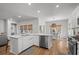 Bright kitchen featuring a stainless steel dishwasher, white cabinets, and an island perfect for meal prep and entertaining at 1016 Saluda River Rd., Myrtle Beach, SC 29588