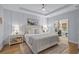 Serene main bedroom featuring soft lighting, wainscoting, neutral decor, and an adjacent office, providing a tranquil retreat at 1016 Saluda River Rd., Myrtle Beach, SC 29588