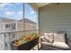 Relaxing balcony with cushioned seating and colorful flowers, providing a cozy outdoor retreat at 126 Ella Kinley Circle # 401, Myrtle Beach, SC 29588
