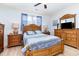 Comfortable bedroom with wooden furnishings, natural light, and neutral-toned walls, creating a serene and inviting space at 126 Ella Kinley Circle # 401, Myrtle Beach, SC 29588